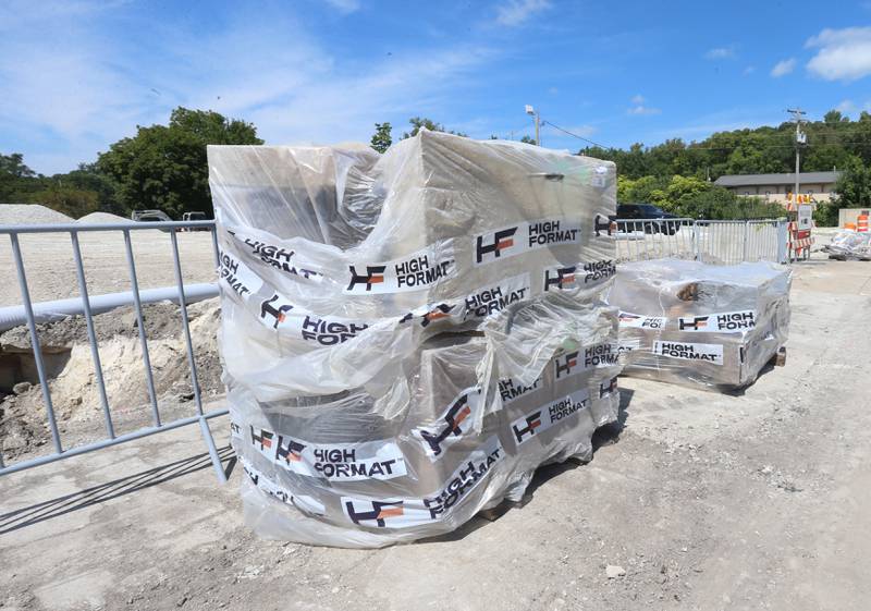 A pallet of stone can be seen at the site of the retail plaza called Market on Mill on Tuesday, Aug. 13, 2024 downtown Utica.