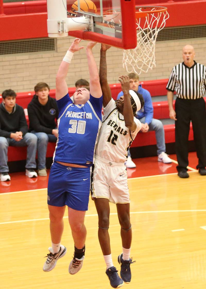 Princeton's Jordan Reinhardt and Oak Forest's Donovan Williams grab a rebound during the Dean Riley Shootin' The Rock Thanksgiving Tournament on Tuesday, Nov. 26, 2024 in Kingman Gym at Ottawa High School.