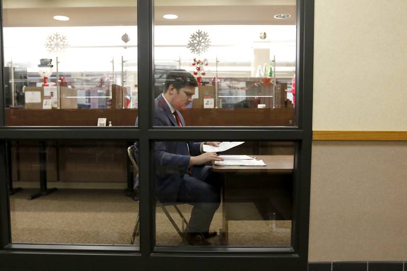 Incumbent Eric Hendricks checks over his paper work as he files his candidate forms to run for reelection for McHenry Count Board District 3 on Monday, Dec. 4, 2023, at the McHenry County Clerk's Office in Woodstock. Monday was the last day for candidates to file ahead of the March primaries.