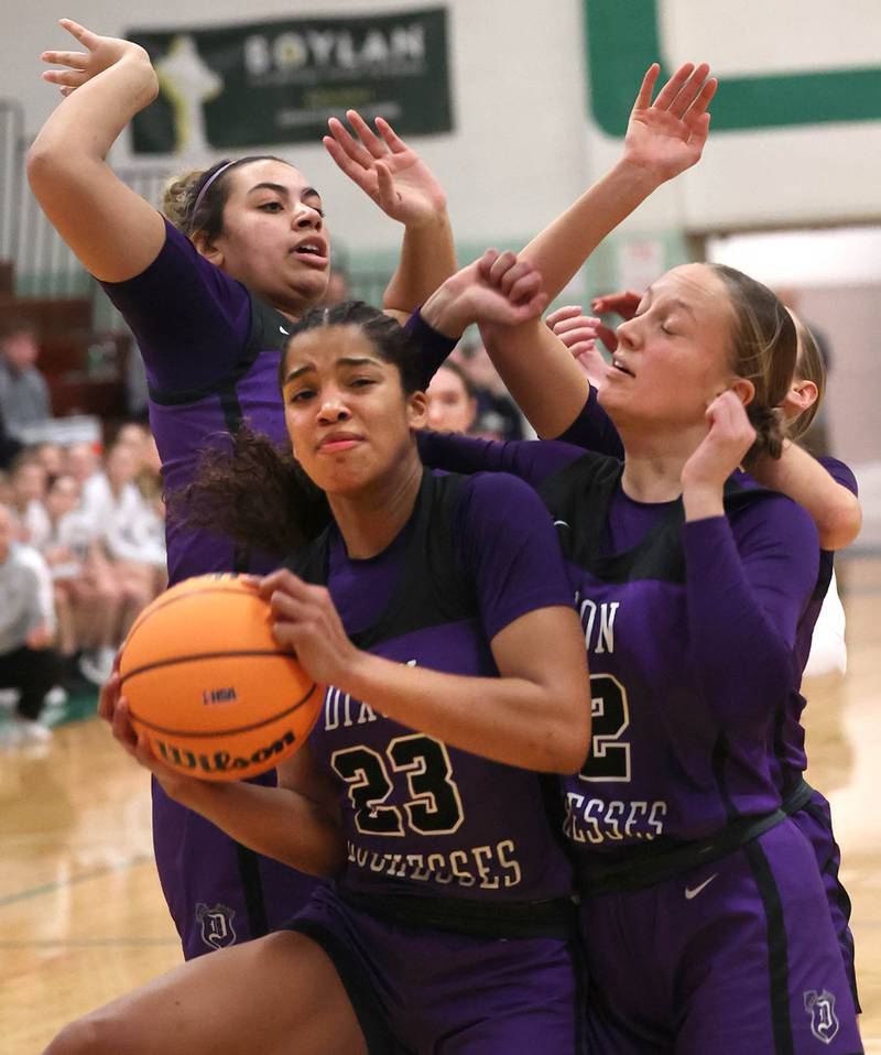 Dixon’s Ahmyrie McGowan comes down with a rebound during their Class 3A sectional semifinal game against Kaneland Tuesday, Feb. 25, 2025, at Boylan Catholic High School in Rockford.