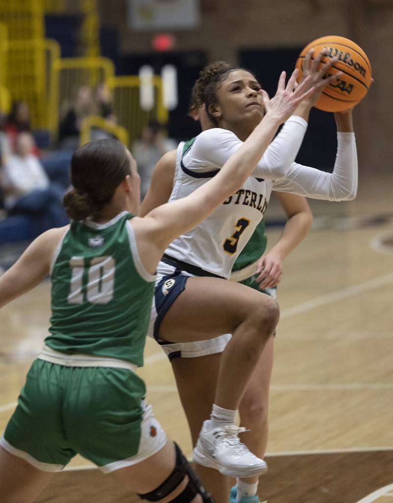 Sterling’s Delali Amankwa puts up a shot against Geneseo’s Hanna Kreiner Thursday, Jan. 30, 2025.