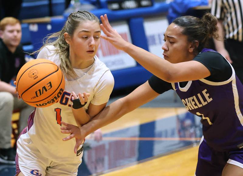 Genoa-Kingston's Presley Meyer tries to drive around Rochelle's Carmela Bright during their game Monday, Dec. 16, 2024, at Genoa-Kingston High School.