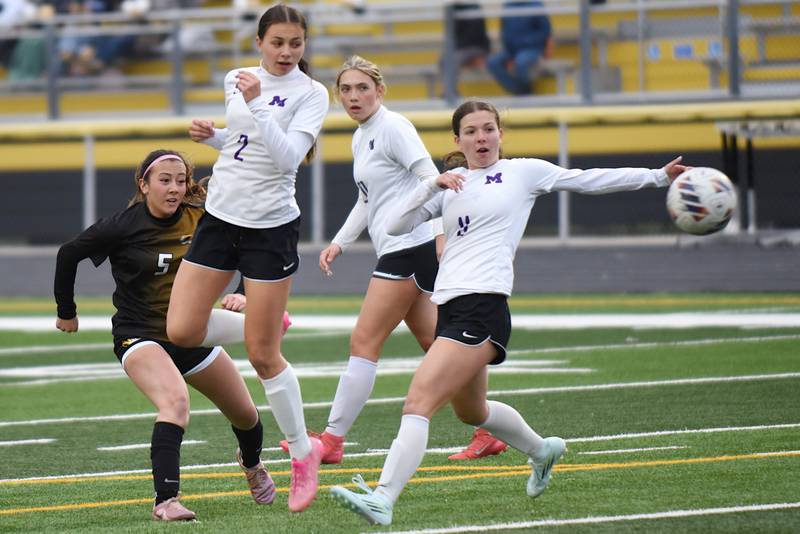 From left, Herscher's Gianni Jaime and Manteno's Peyton Boros, Madison Bormann and Morgan Derrico watch Jaime's shot go towards the goal during a game at Herscher Tuesday, May 5, 2026.