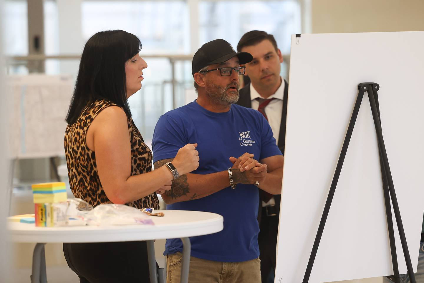 Brent Fraser, Chief Operating Engineer for the City of Joliet, goes over potential sites for redevelopment with Joliet City Council member Suzanna Ibarra at the Open House for city redevelopment plans around Gateway Center on Tuesday June 11, 2024 in Joliet.