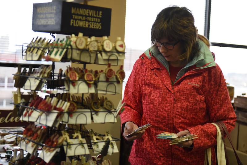 Ellen Stringer, of Bourbonnais, shops at a Winter Market held at the Kankakee Public Library.