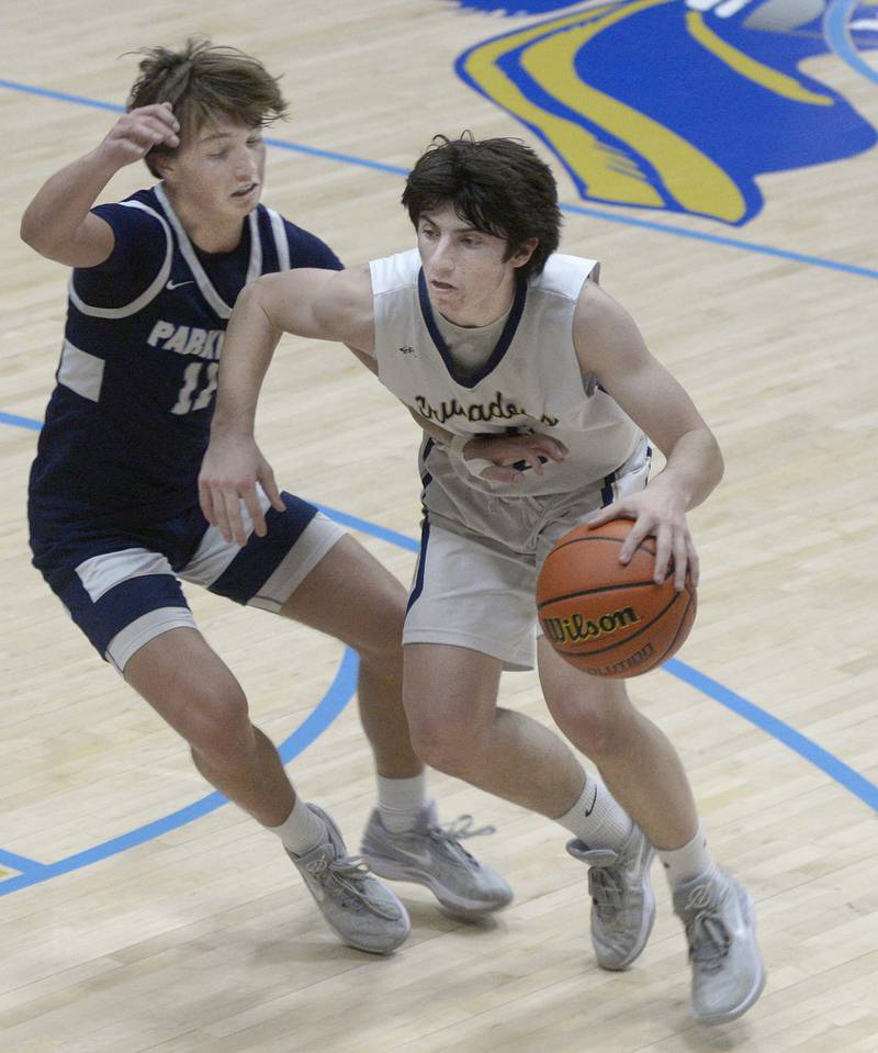 Parkview 2  Marquette’s Alec Novotney tries to get past Parkview Christian’s Ashton Wilson on a drive to the basket in 2nd period Thursday at Marquette.
