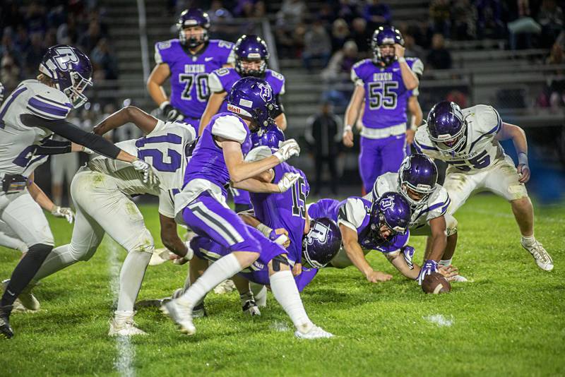 Dixon’s Rylan Ramsdell pounces on a fumble against Rockford Lutheran Friday, Sept. 30, 2022.