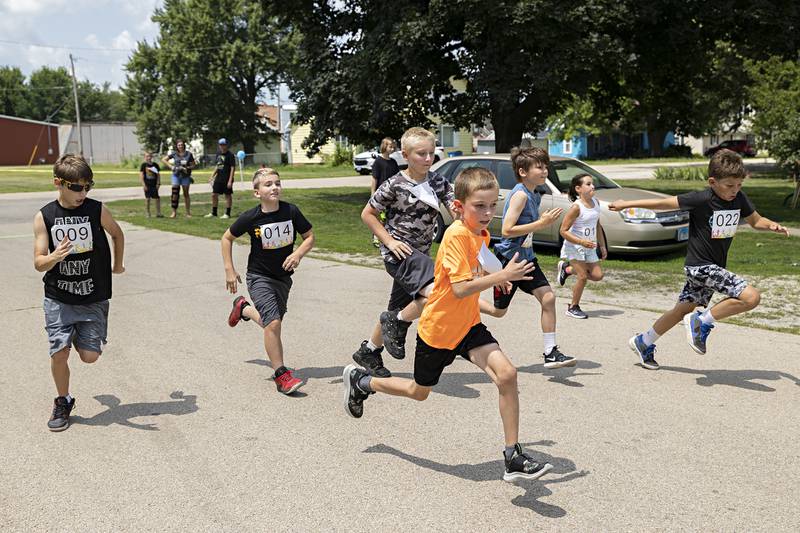 Fun runners sprint for the finish line Saturday, July 22, 2023 in Tampico. Five age groups of runners took part in the kid’s two-block run.