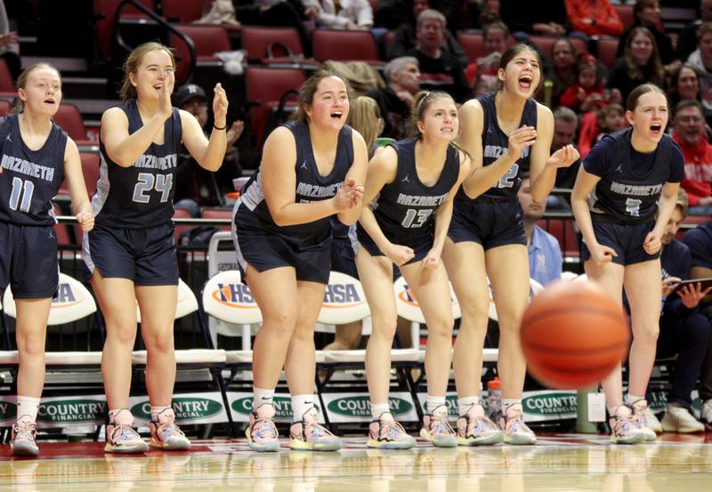 Nazareth players cheer from the bench during the Class 3A girls basketball state semifinal against Peoria at Redbird Arena in Normal on Friday, March 3, 2023.