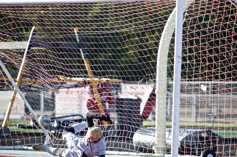 St. Charles East's Jason Striegel tries to stop the goal attempt by St. Charles North on Thursday, Sept. 25, 2025 in Batavia.