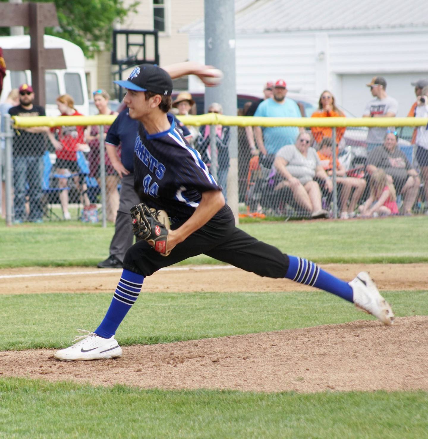 Newman's Kyle Wolfe throws a pitch against Warren on Saturday, May 28, 2022.