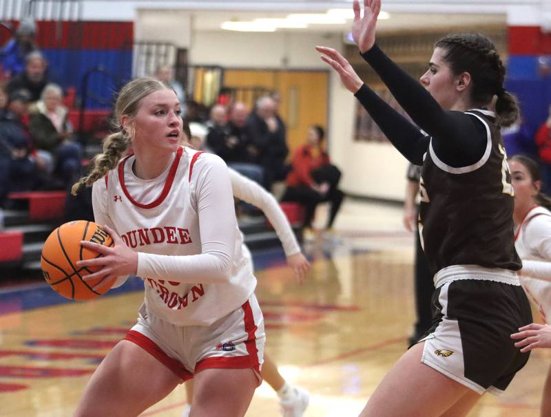 Dundee-Crown’s Olivia Rodriguez moves the ball against Jacobs in varsity girls basketball on Friday, Dec. 12, 2025, at Dundee-Crown High School in Carpentersville.