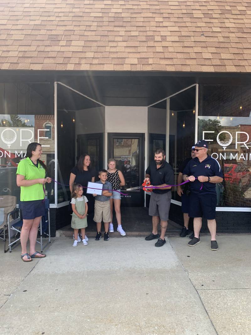 Fore on Main celebrated it's grand opening with a ribbon-cutting Saturday, July 20, 2024, attended by friends, family, public officials and patrons. (from left) Heather Cursley, Kinley Kaminski, Molly Kaminski, Parker Kaminski, Olivia Kaminski, Nick Kaminski, Bobby Kaminski, Jim Hollenbeck)