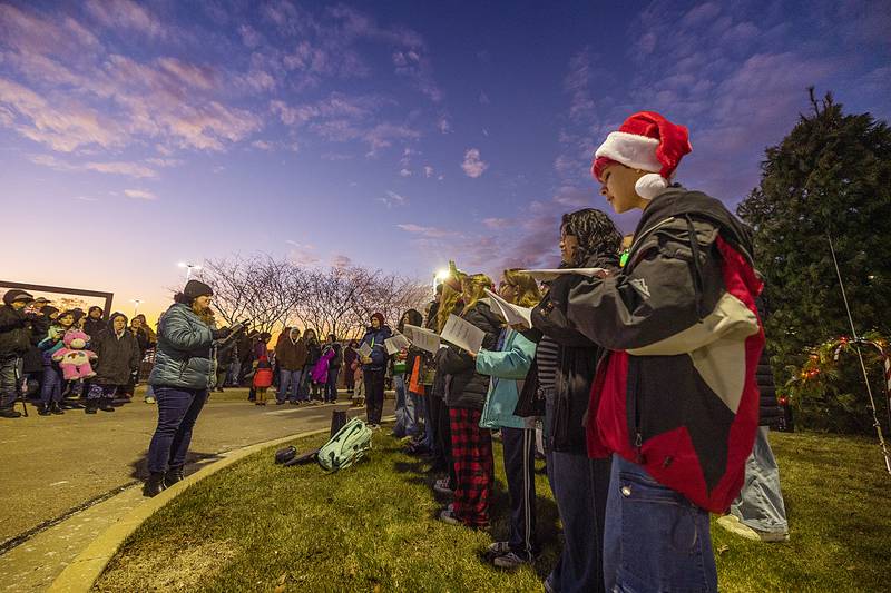 The Reagan Middle School eighth grade choir starts the festivities Friday, Dec. 6, 2024, for the Dixon Christmas Walk. The group sang outside of KSB for the tree lighting ceremony.