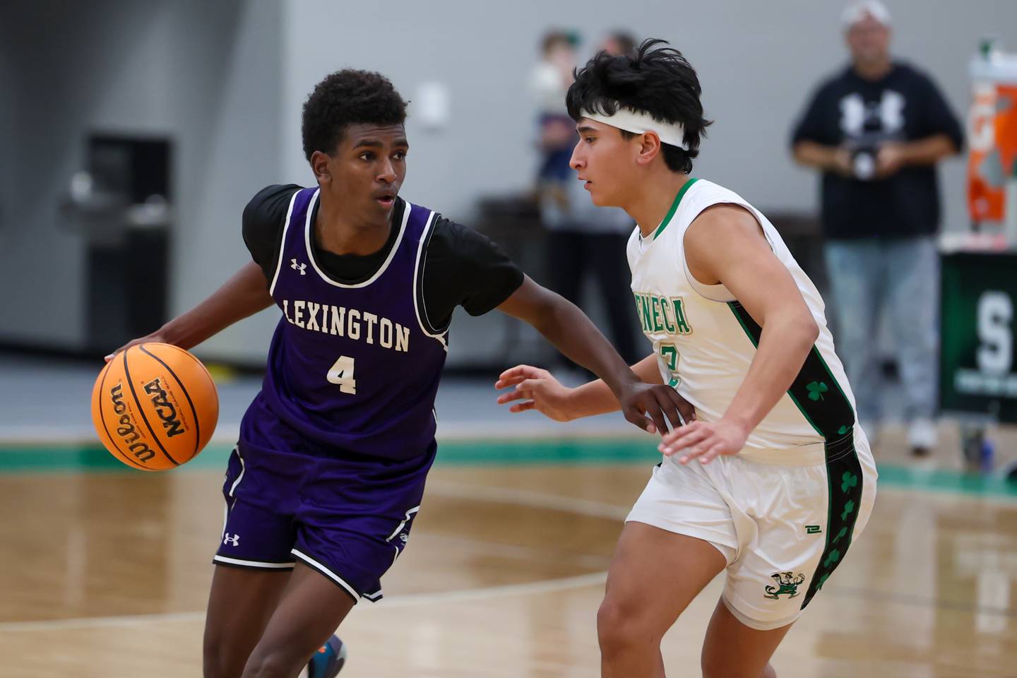Micah Coffman of Lexington dribbles ball in lane whilst being guarded by Jesus Govea of Seneca on Saturday, December 28, 2024 at Seneca High School in Seneca.