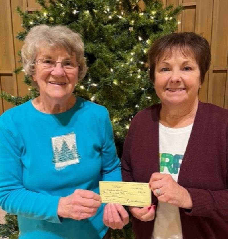 Pictured are Lions Club member Mickey Farley, left, and Sandwich P.E.O. President Linda Benson.