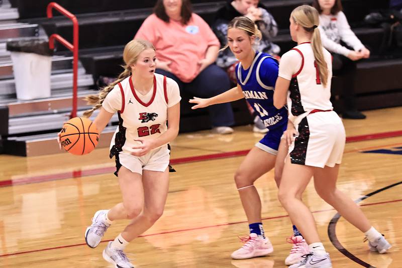 Erie-Prophetstown’s Lauren Punke blocks Newman's Brooklyn Smith for fellow Panther Aubrey Misfeldt to work her way into the basket Thursday, Dec. 11, 2025, in Erie.