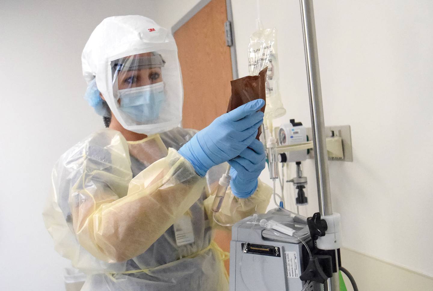 A nurse at Morris Hospital prepares a monoclonal antibody infusion therapy for administration.