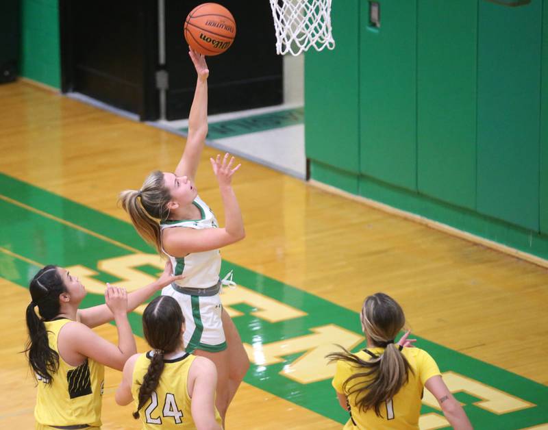 Seneca's Audry McNabbb drives to the hoop past Putnam County defenders Esmeralda Avila, Maggie Richetta and Ava Hatton to score on Thursday, Jan. 4, 2024 at Seneca High School.