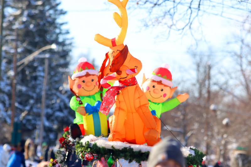 Jolly inflatables greet parade goers during the Merry Cary Christmas Parade in Cary on Sunday, Dec. 7, 2025 in Cary.