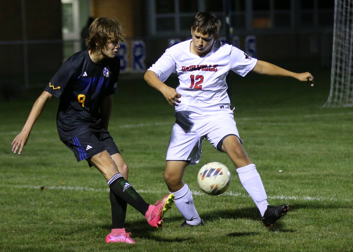 Somonauk's Benson Gudmonson kicks the ball between Earlville's Grady Harp in the Little Ten Conference championship game on Thursday, Oct. 5,  2023 at Hinckley High School.