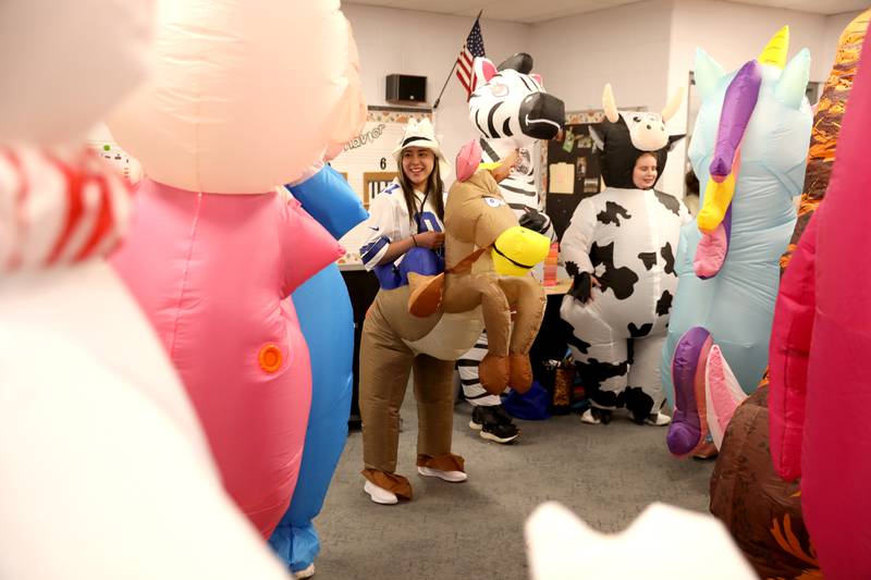 Angelina Solano, as a cowboy on a horse, and other teachers and staff members surprised students at Emily G Johns Elementary School in Plano with an inflatables race on Tuesday, May 27. 2025 after the all-school field day to celebrate the end of the school year.