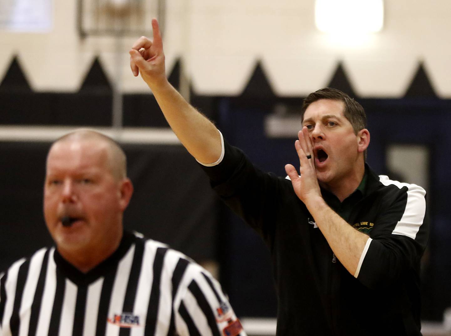 Crystal Lake South Head Coach Matt LePage calls in a play during a IHSA Class 3A Kaneland Boys Basketball Sectional semifinal game against Freeport on Feb. 27, 2024, at Kaneland High School in Maple Park.