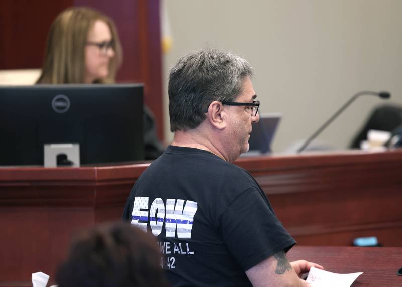 Philip Caporaso, father of Christina Musil, gives a victim impact statement with Circuit Court Judge Marcy Buick in the background Tuesday, Aug. 26, 2025, during the sentencing hearing for Nathan P. Sweeney at the DeKalb County Courthouse in Sycamore. Sweeney received the maximum 14 years for driving under the influence and causing the 2024 crash that killed DeKalb County sheriff’s deputy Musil.
