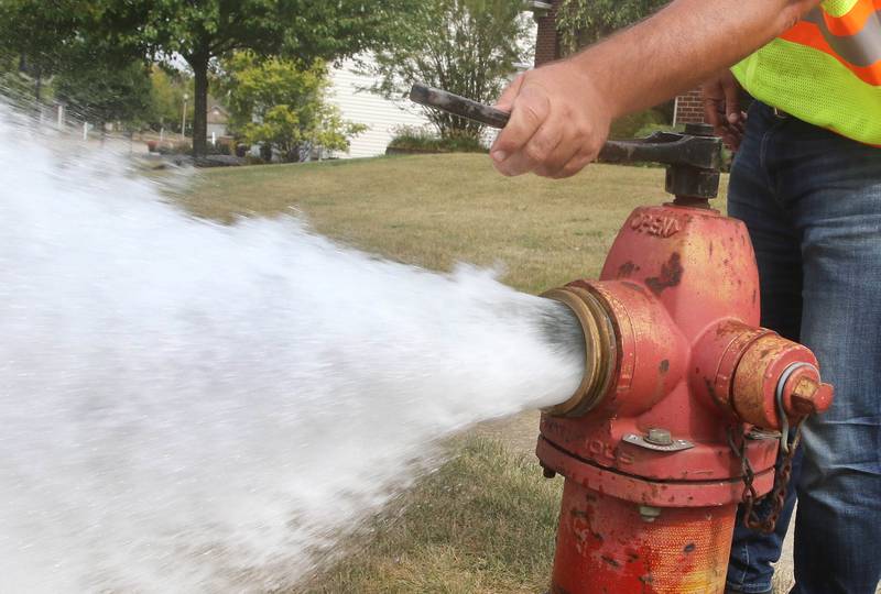 A fire hydrant is flushed