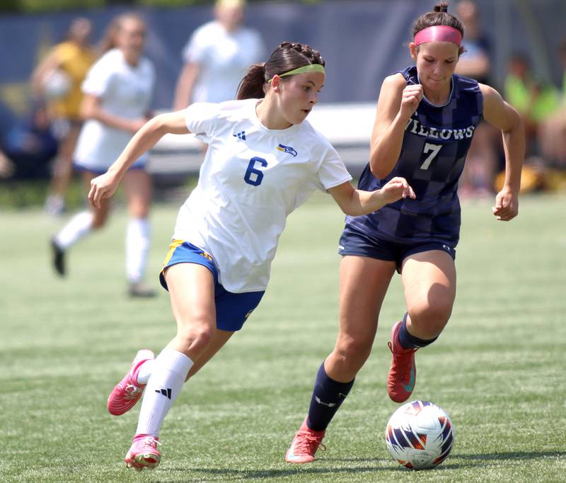 Johnsburg’s Liz Smith cruises past Willows Academy’s Erin Mongoven  in IHSA Class 1A Supersectional soccer action at Dominican University in River Forest on Saturday, May 31, 2025.