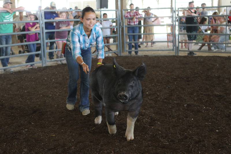 Ryann Ray, 22, of Mundelein shows her pig named, Mabel, in the Livestock Auction during the Lake County Fair at the Lake County Fairgrounds on Saturday, July 29th in Grayslake.  
Photo by Candace H. Johnson for Shaw Local News Network