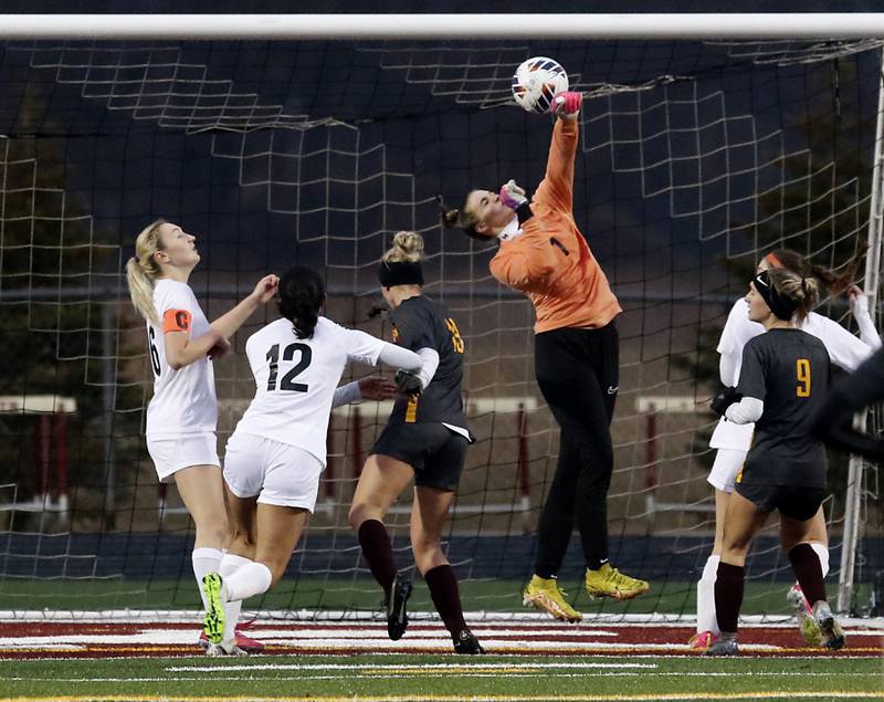 McHenry's Makenna Harvey hits the ball hits the ball away from the gaol during a non-conference girls soccer match Thursday, March 16, 2023, at Richmond-Burton High. McHenry defeated Richmond Burton 4-0, in the first game of the season for both teams.
