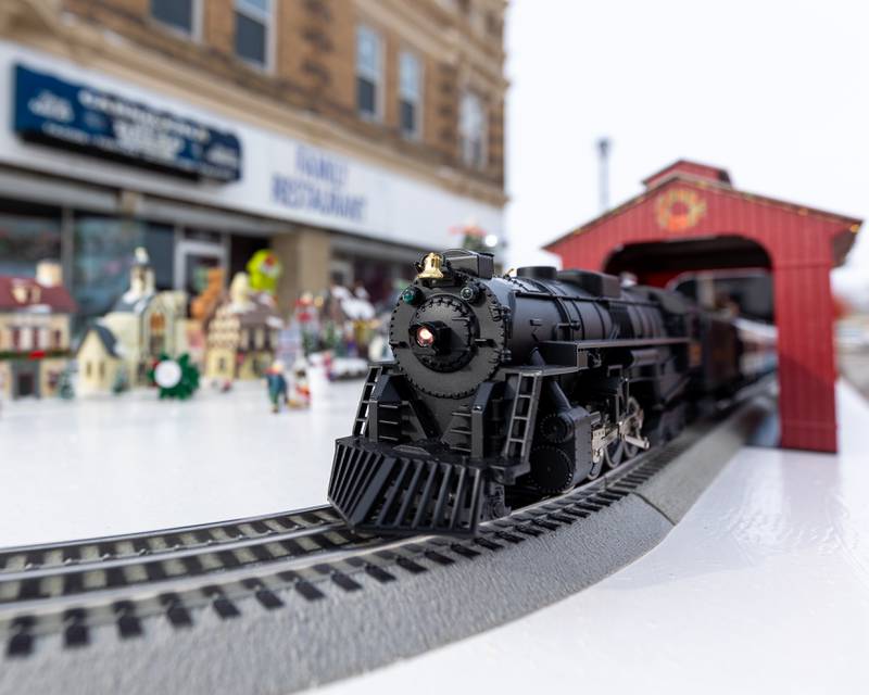 The "Polar Express" toy train drives through tunnel on Saturday, December 6, 2025 on Illinois Avenue in Mendota.
