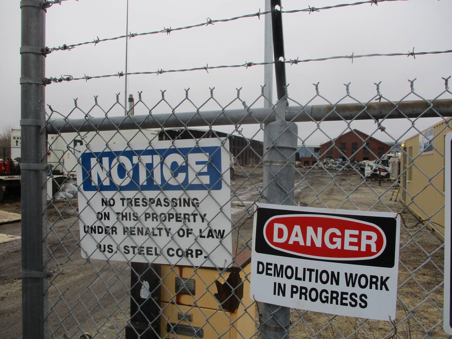 Signs post notice of demolition in progress Wednesday at the old U.S. Steel property on Collins Street in Joliet. March 5, 2025