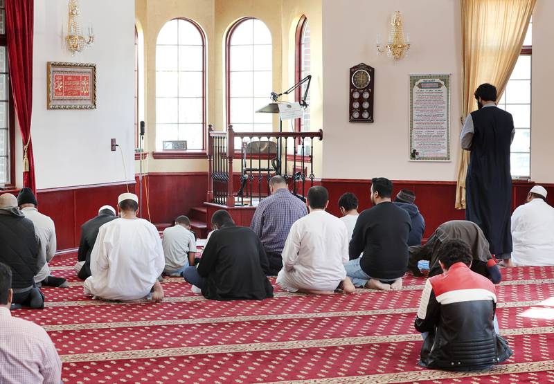 Individuals assemble to pray Friday, April 7, 2023, in the prayer hall or musallā at the Islamic Center of DeKalb. Muslims are currently observing the holy month of Ramadan.