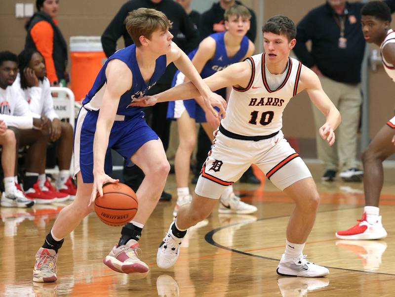 DeKalb’s Eric Rosenow plays defense against Geneva’s Hudson Kirby Thursday Dec. 28, 2023, during their second round game in the 96th Chuck Dayton Classic boys basketball tournament at DeKalb High School.