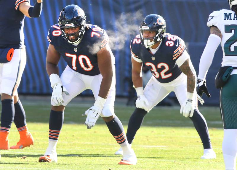 Chicago Bears offensive tackle Braxton Jones lines up in front of running back David Montgomery for a play during their game against the Eagles Sunday, Dec. 18, 2022, at Soldier Field in Chicago.