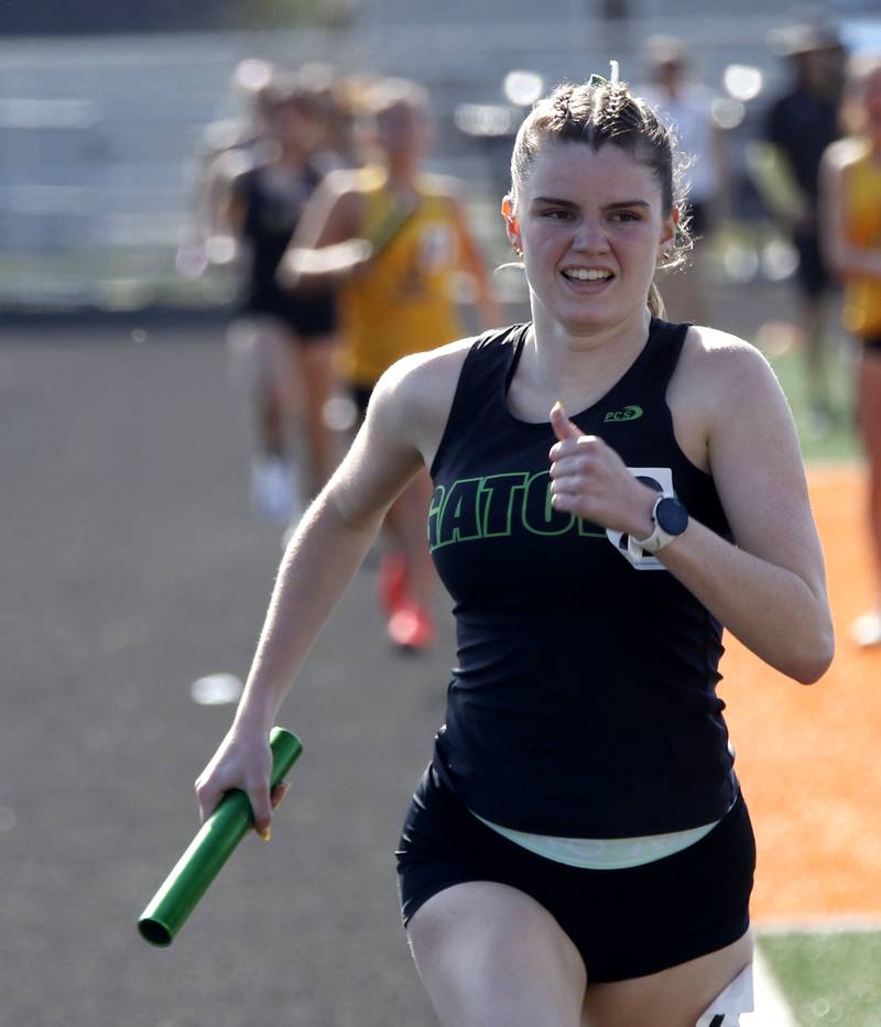 Crystal Lake South’s Laynie Ripley runs to the finish line  as South wins the 4 x 800 meter relay on Thursday, April 23, 2026, during the McHenry County Track and Field Meet at McCracken Field in McHenry.