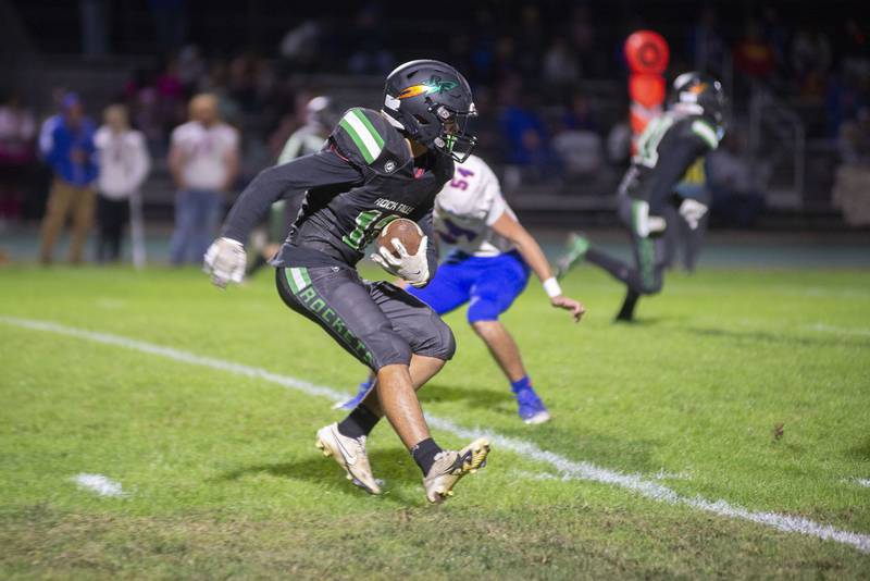 Rock Falls’ Austin Castaneda looks for yards Friday, Sept. 23, 2022 against Genoa-Kingston.