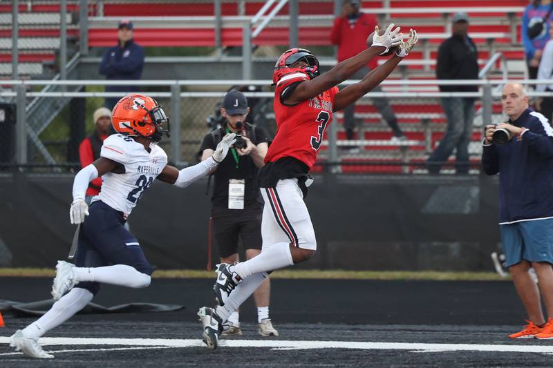 Bolingbrook’s Chico Thomas stretches for the touchdown catch against Naperville North on Friday, Sept. 8, 2023 in Bolingbrook.