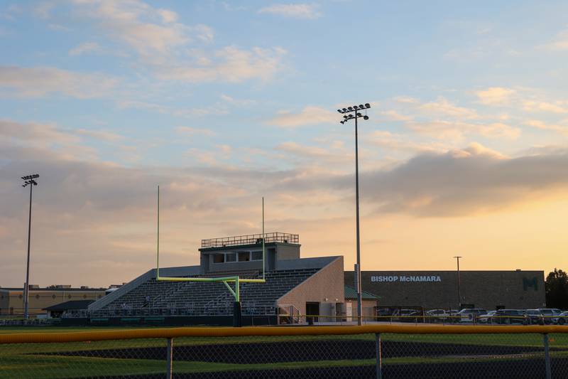 The sun sets behind Bishop McNamara's new Rich Zinanni Athletic Complex on Thursday, Aug. 21, 2025.