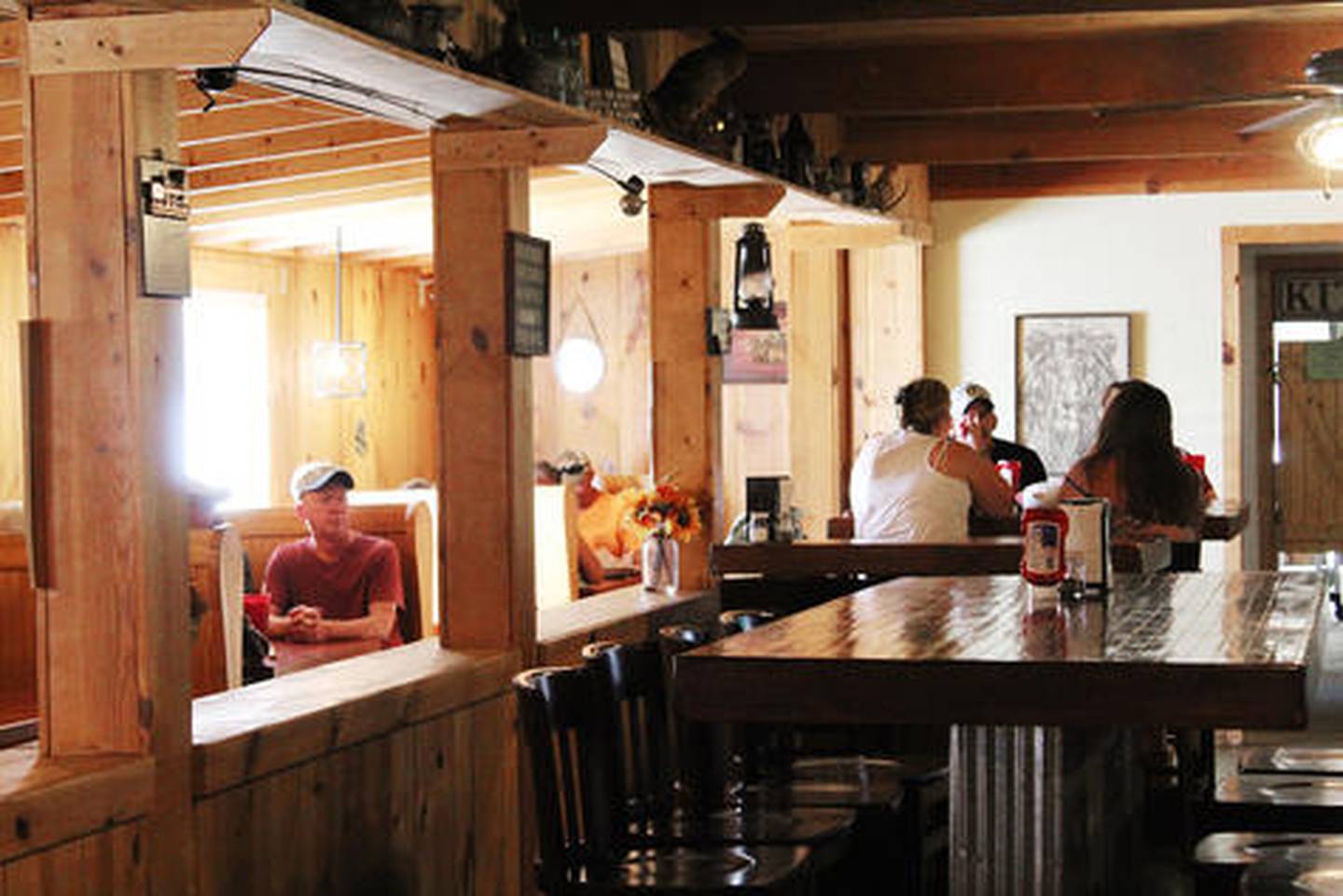 Diners inside the Riverview Lodge near Thomson, along the Mississippi River.