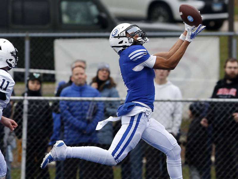Geneva's Talyn Taylor catches a touchdown pass during an IHSA Class 6A semifinal football game against Cary-Grove on Saturday, Nov. 23, 2024, at Geneva High School.