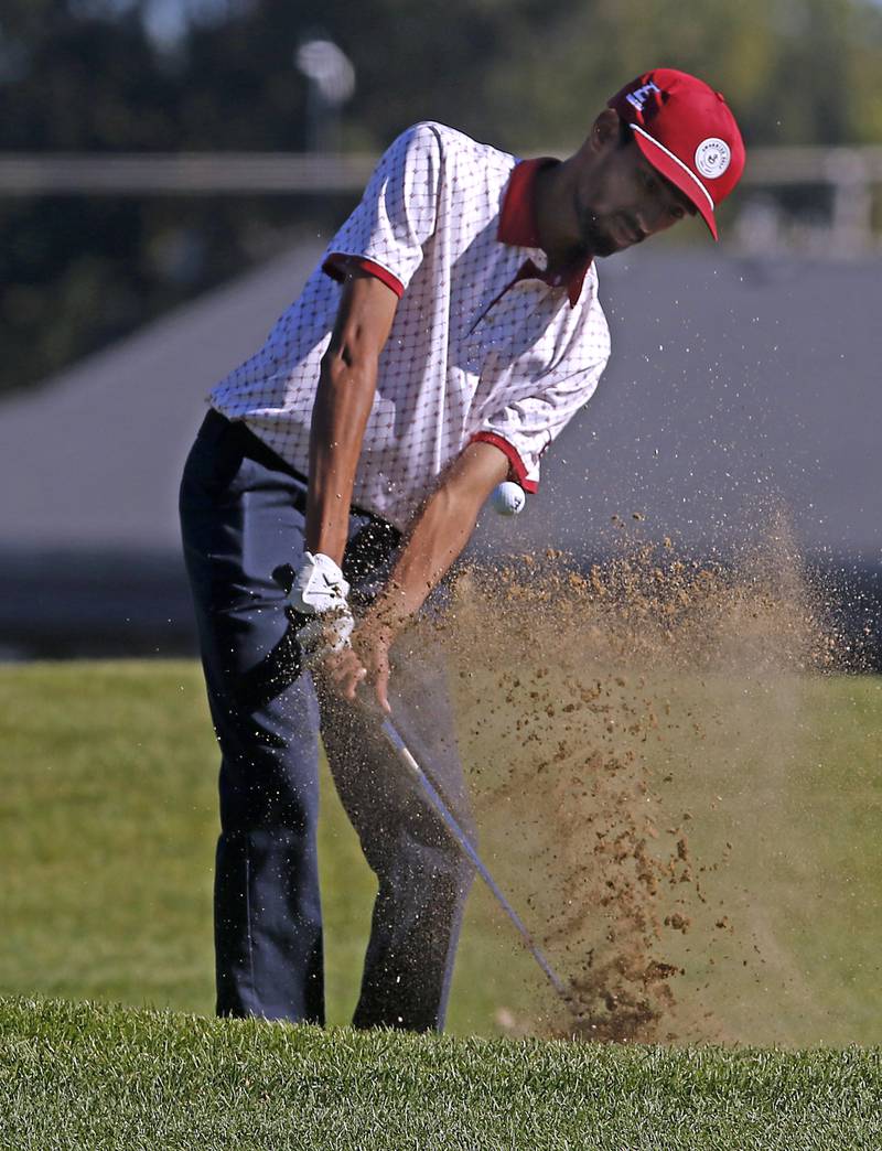 Elgin’s Aarav Patel hits out of the sand trap on the tenth hole during the IHSA Class 3A Dundee-Crown Regional golf tournament on Wednesday, Oct. 2, 2024 at Randall Oaks Golf Club in West Dundee.