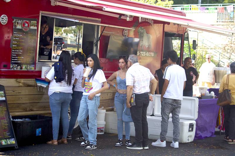 Visitors order food at Fiesta en el Bicentennial Park at Saturday, Sept. 14, 2024 at Billie Limacher Bicentennial Park in Joliet.