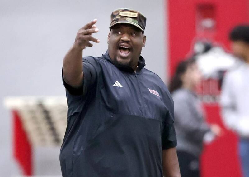 Northern Illinois University football head coach Thomas Hammock instructs his team Tuesday, March 26, 2024, during spring practice in the Chessick Practice Center at NIU.