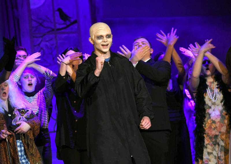 Oregon High School music students rehearse a scene from "The Addams Family" on Tuesday as preparation for their upcoming performances this week. Here, Uncle Fester, played by Austin Peterson, sings during one of the scenes.