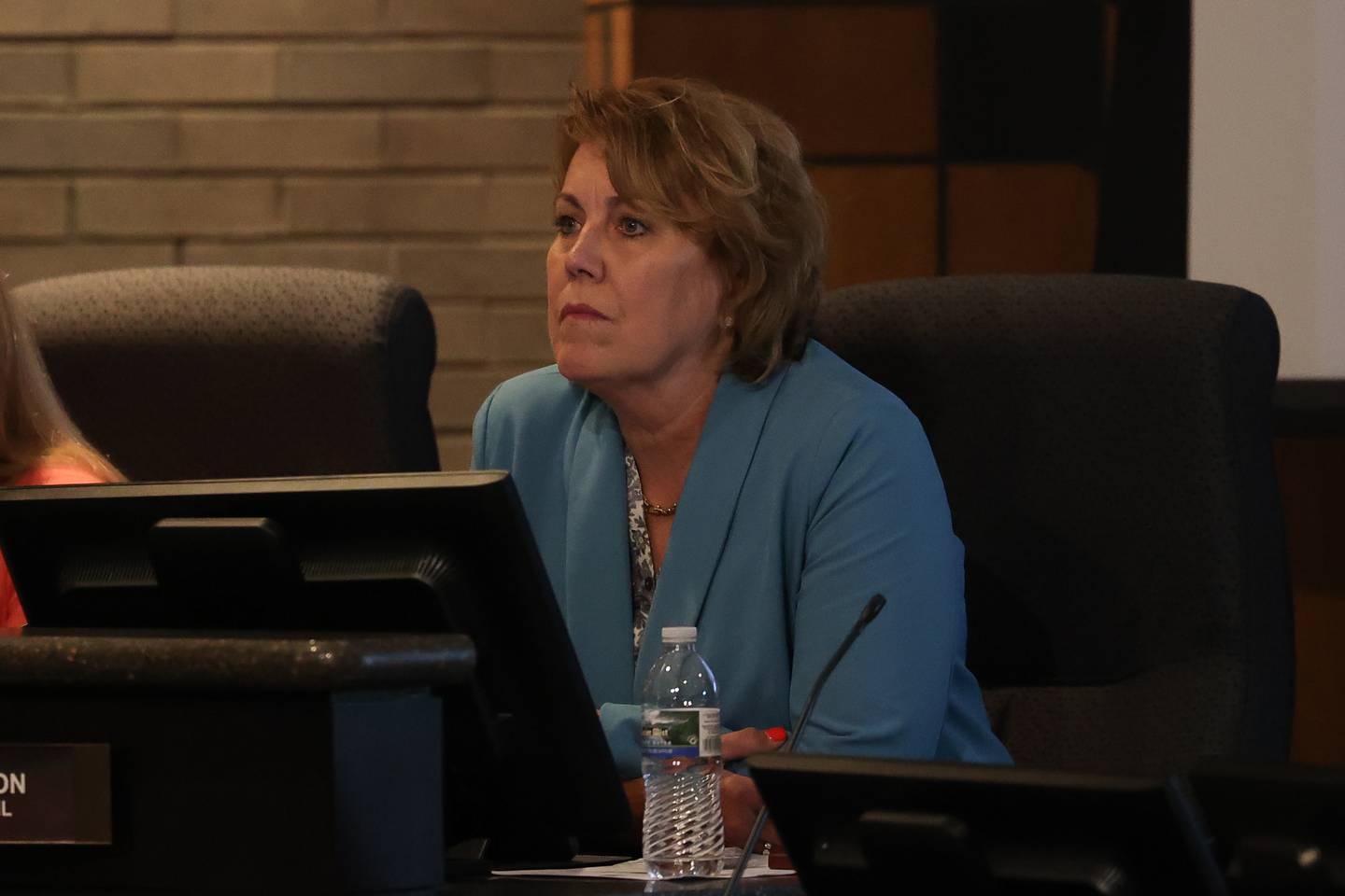 Joliet City Council member Sherri Reardon listens to a speaker at the Joliet City Council meeting on Tuesday, July 18th, 2023.