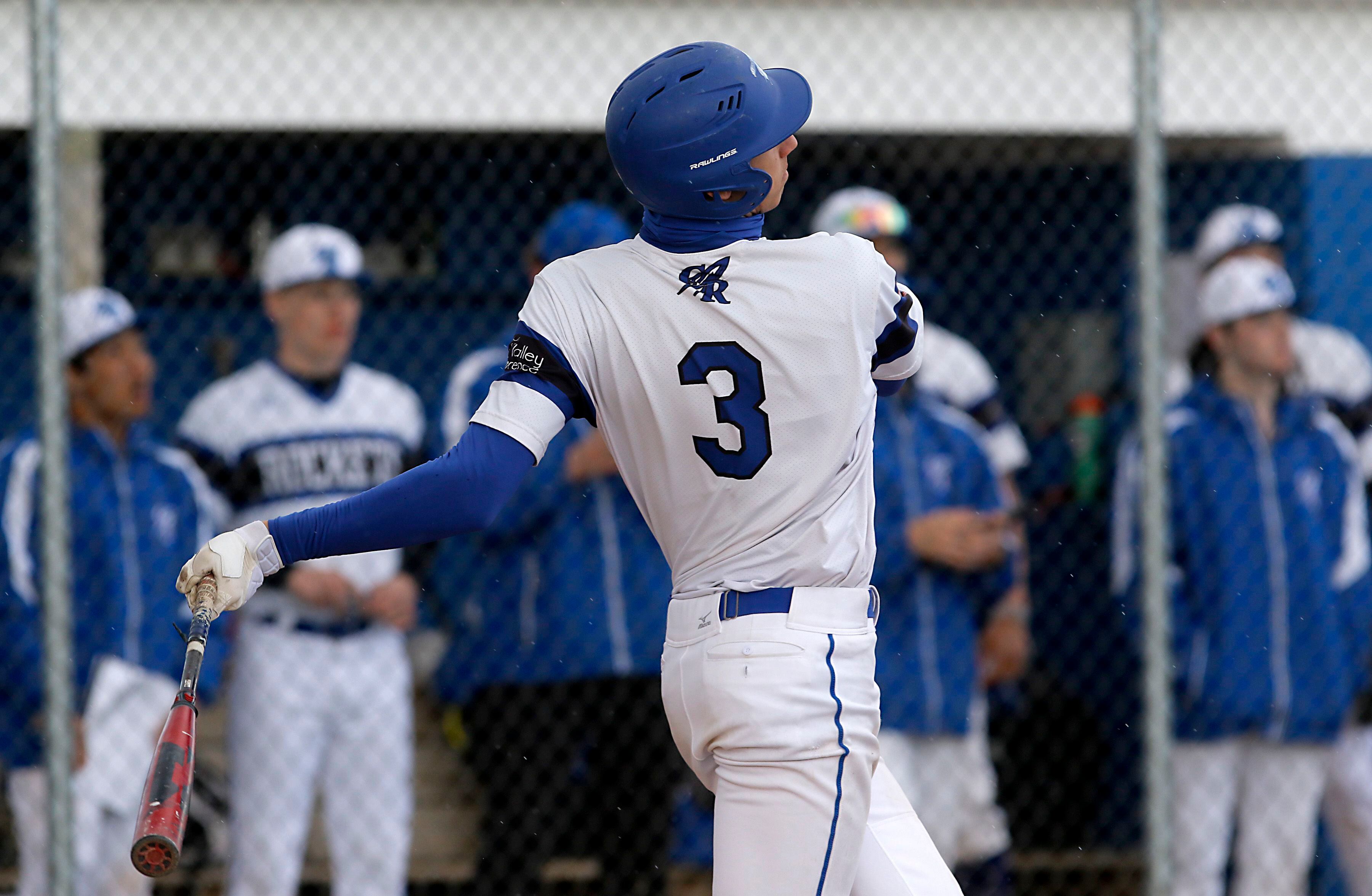 Burlington Central's Andrew Payton watches his grand slam homer during a Fox Valley Conference baseball game on Friday, April 12, 2024, at Burlington Central High School. 