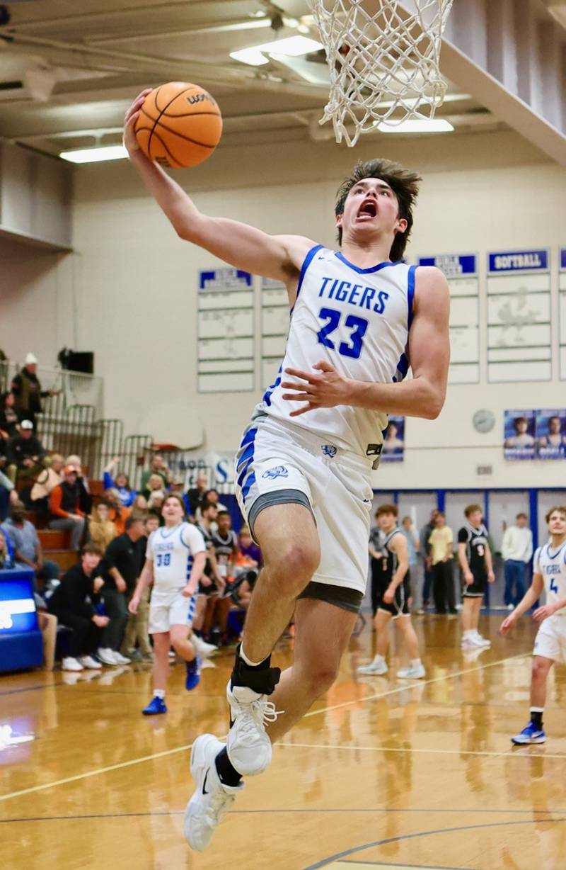 Princeton's Noah LaPorte soars for a basket Saturday night at Prouty Gym against Byron. PHS won 53-51.